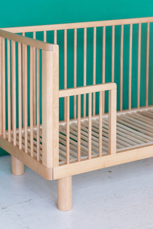 natural wood baby cot with junior rail