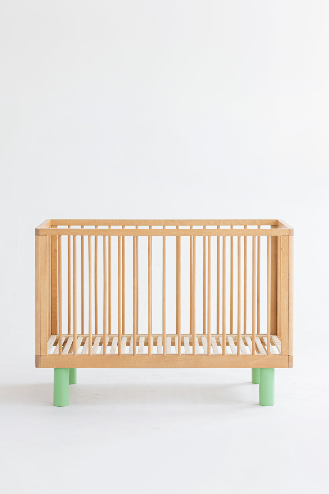 Nox cot in natural wood and green