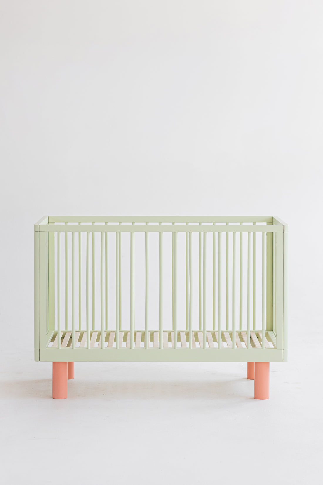 Nox cot in pistachio and pink