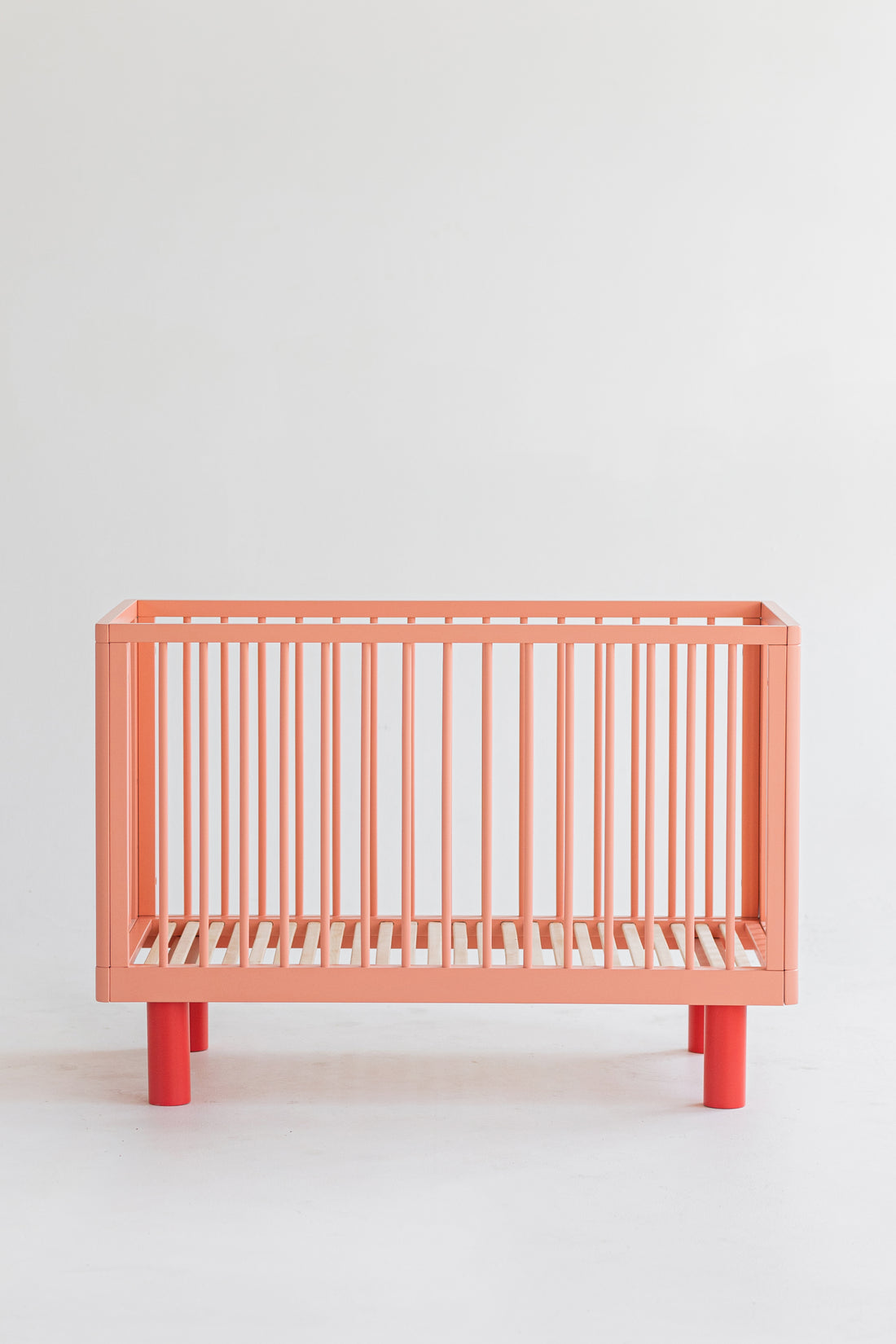 Nox cot in pink and red