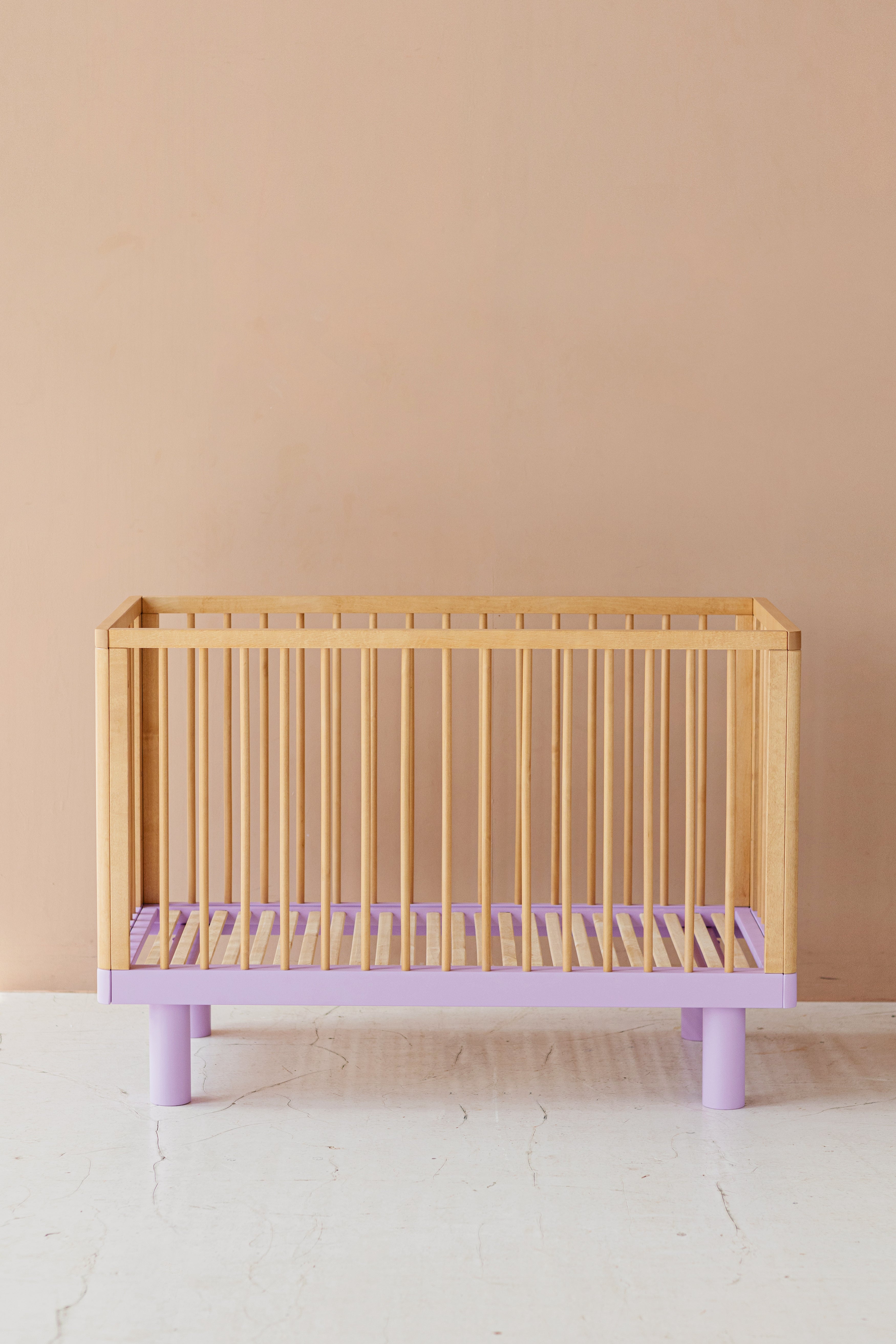 Nox cot in natural wood and lavender conversion rail in natural wood and lavender ON PRE ORDER. Estimated shipping date 27.12.24